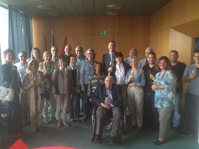 Club members gathered together at a club function, raising glasses